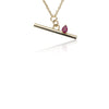 A Gold Line Necklace With A Ruby