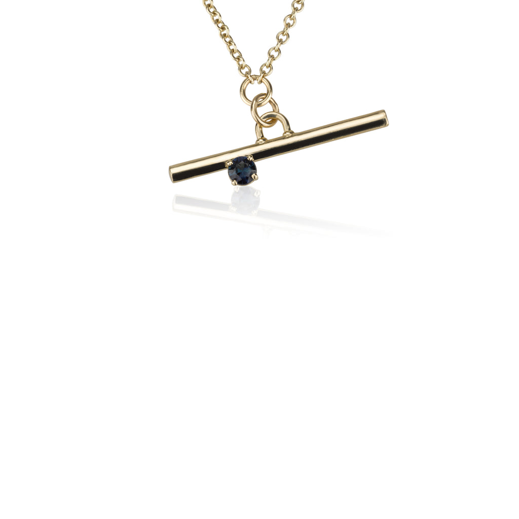 A Gold Line Necklace - With A Sapphire